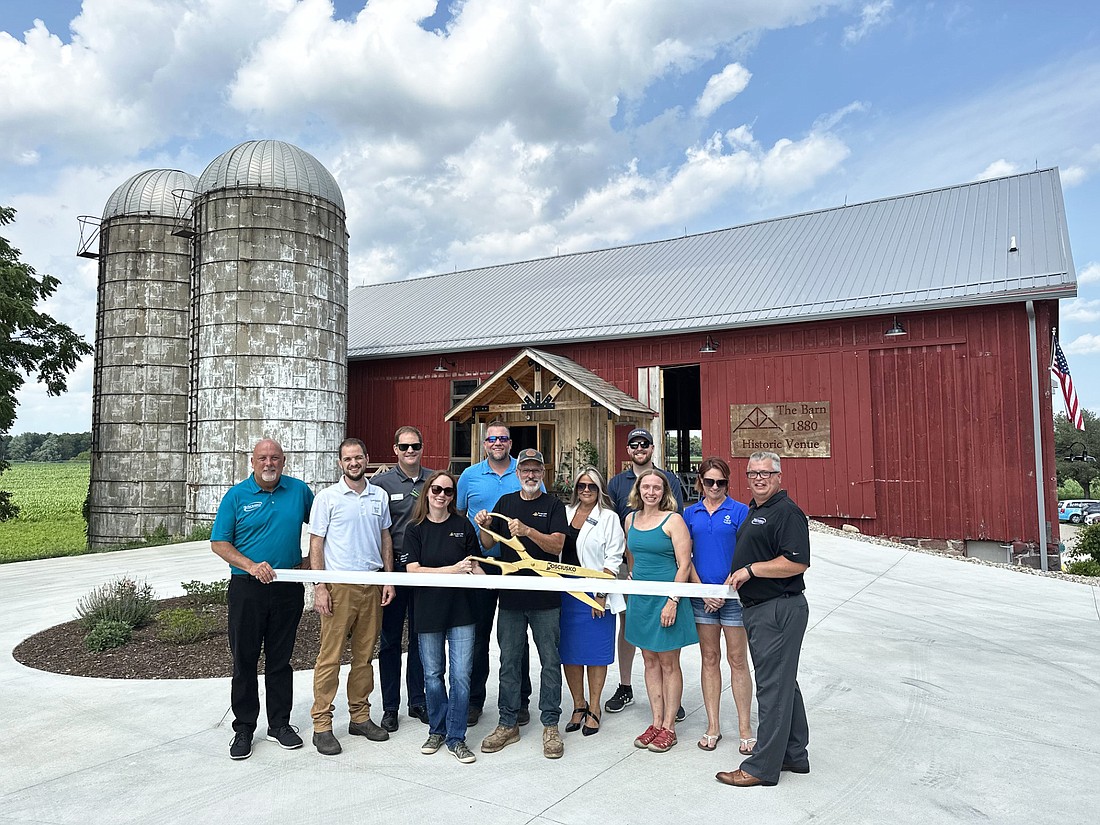 Kosciusko Chamber of Commerce had a ribbon-cutting ceremony Tuesday with The Barn 1880: Historic Venue, 2076 N. CR 100E, Warsaw. Pictured (L to R) are Scott Wiley, Chamber member relations manager; Jon Vida, Rabb Water, Chamber ambassador; Ben Snyder, Humana, Chamber ambassador; Amanda and Jonathon Scroggs (with scissors), The Barn owners; Chad Hummel, Silveus Insurance, Chamber ambassador; Stacey Leek, Stillwater Hospice, Chamber ambassador; Andrew Lynch, Amazon, Chamber ambassador; Kelly Mager, Kcountyevents.com; Stacie Schlichtenmyer, The Watershed Foundation, Chamber ambassador; and Rob Parker, Chamber president and CEO. Photo by David Slone, Times-Union