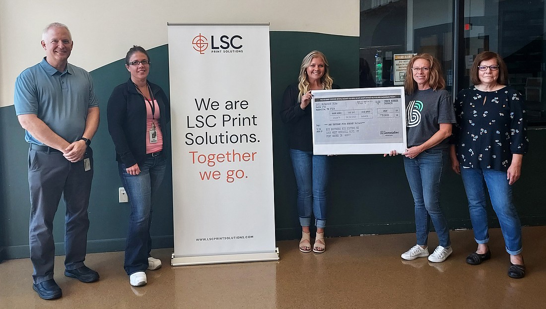 Pictured (L to R) are John Pierog, vice president of manufacturing for LSC Communications; Belinda Conrad, environmental health and safety representative for LSC Communications; Tori Newsome, environmental health and safety manager for LSC Communications; Tammy Smith, community development director, Big Brothers Big Sisters of Northeast Indiana; and Cindy Ambrose, charitable contributions coordinator for LSC Communications. Photo by Jackie Gorski, Times-Union.