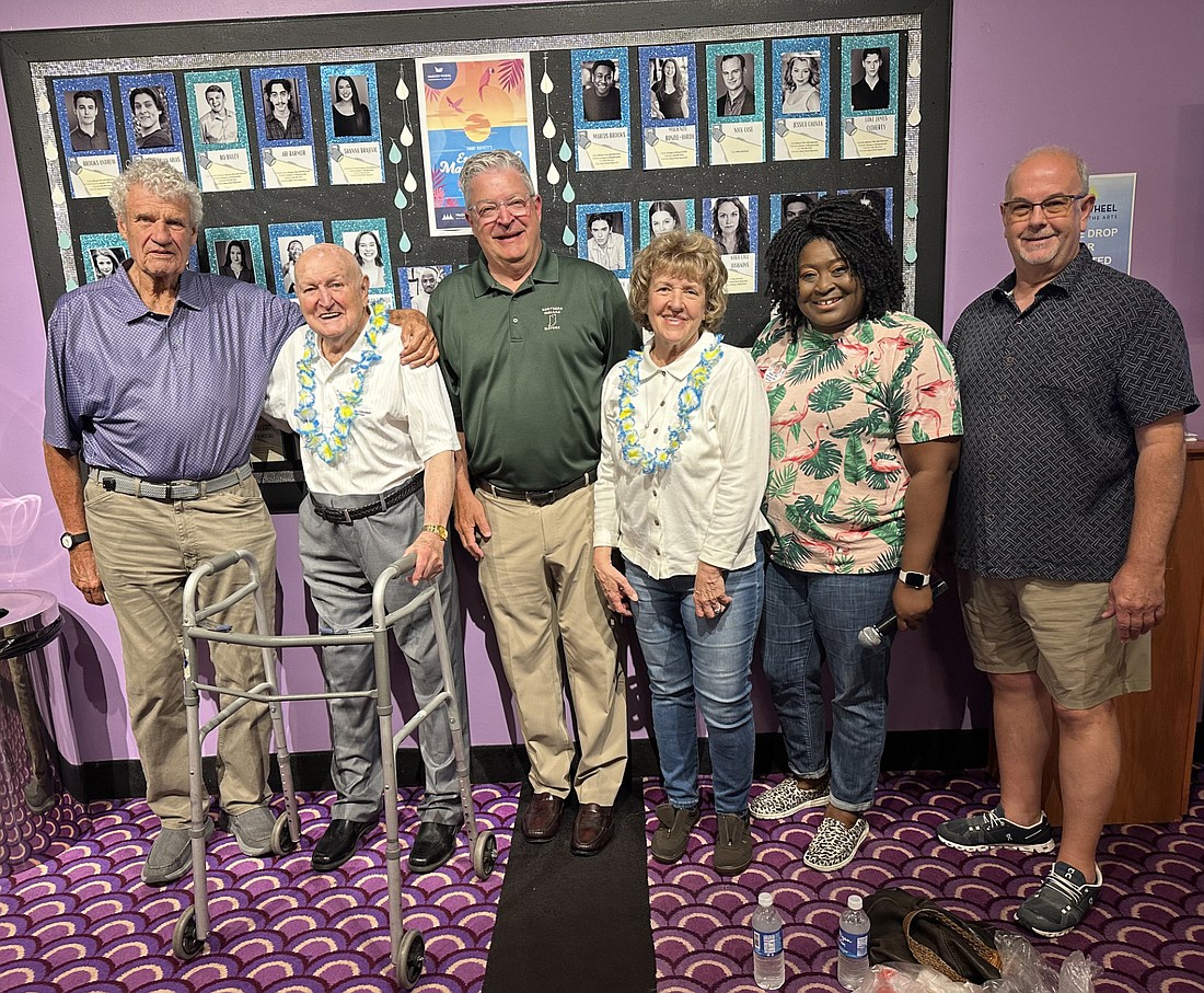 Max Poorman (L) turns 100 on July 12. He hasn’t missed a summer show at the Wagon Wheel Center for the Arts since 1956. On Thursday, before the matinee showing of Jimmy Buffett’s “Escape to Margaritaville,” the Wagon Wheel celebrated Poorman. Pictured (L to R) are John Hall; Poorman; Joe Thallemer, Warsaw mayor; Arlene Emrick, Poorman’s daughter; Lakesha Green, Wagon Wheel executive director; and Bruce Shaffner, former owner of Wagon Wheel and friend of Poorman. Photo by David Slone, Times-Union.