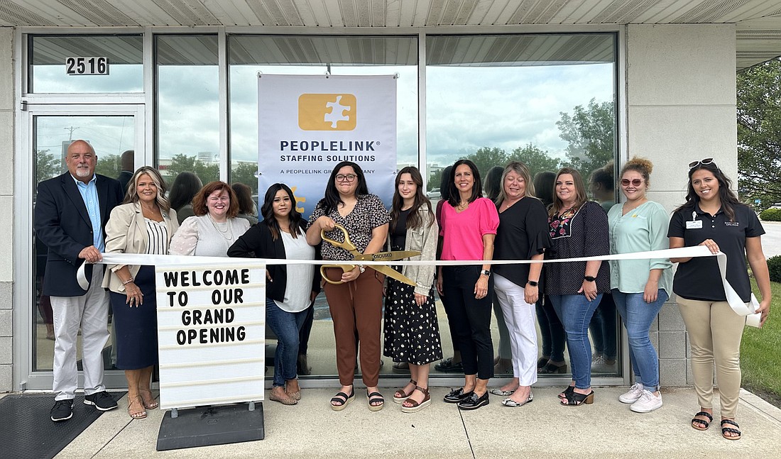 Peoplelink Staffing Solutions had a ribbon-cutting ceremony and grand opening Thursday with the Kosciusko Chamber of Commerce for Peoplelink’s relocation to 2516 Walton Blvd., Warsaw. Pictured (L to R) are Chamber Member Relations Manager Scott Wiley; Stacey Leek, Stillwater Hospice, Chamber ambassador; Amanda Sautter, WorkOne, Chamber ambassador; Avelina Gonzalez, Jessica Parra, Isabel Rayner, Christi Smith, Tara Burns, Wendy Lane and Isabella Erp, all of Peoplelink; and Raquel Kline, Paddock Springs, Chamber ambassador.
Photo by David Slone, Times-Union