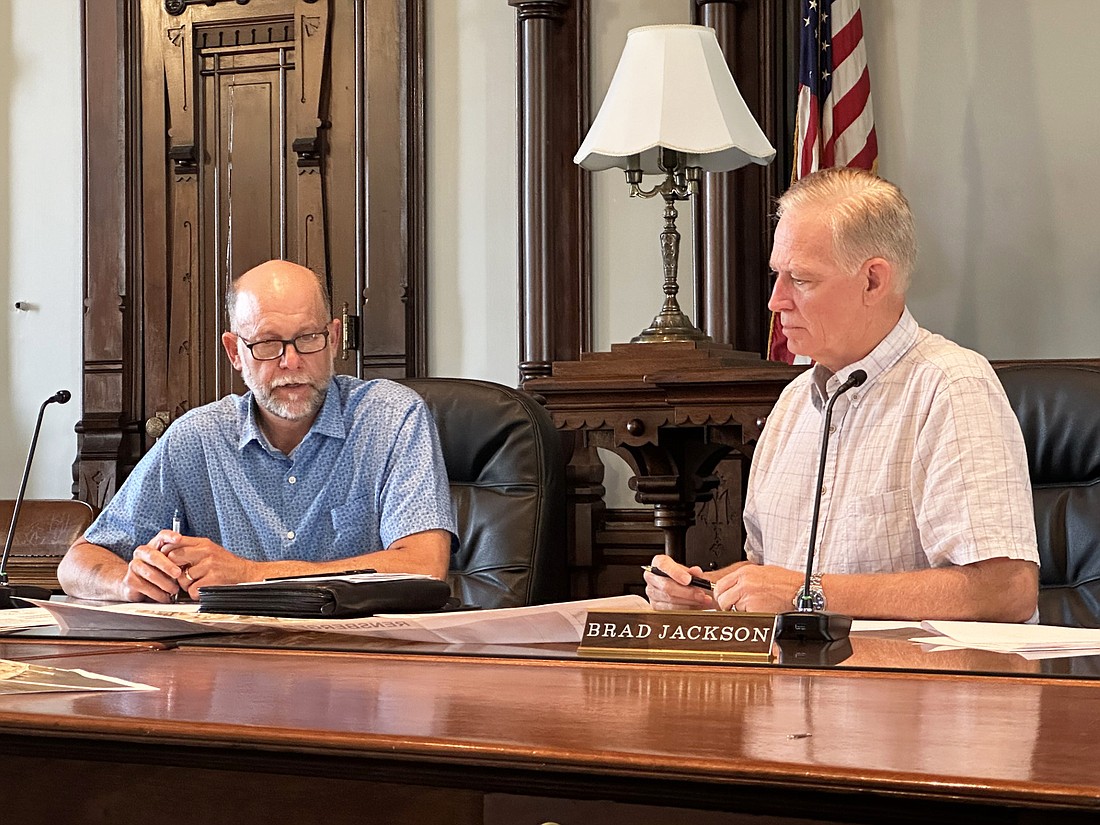 Kosciusko County Commissioners Cary Groninger (L) and Brad Jackson (R) review the nonprofit funding requests Tuesday for 2024. Photo by David Slone, Times-Union