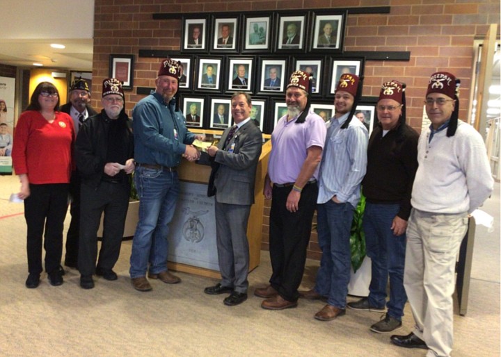 Pictured (L to R) are Kathy Breske and John Mort, American Legion; Don Smith, chairman; Nathan Ousley, president, Shrine Club; Dan Winter, Shrine Hospital; Jeff Kinsey, Danny Kline, Todd Speicher and John Sadler. Kosciusko County Shrine. Photo Provided