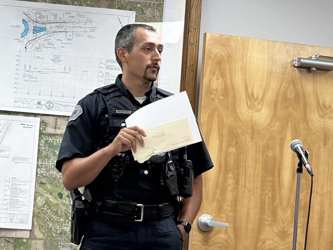 Winona Lake Police Department DARE officer Phillip Hawks requests permission Tuesday from the town council to purchase football tickets to take Lakeland Christian Academy eighth-graders to a “Faith and Football” program. The Miller Foundation provided funding for the tickets. Photo by David Slone, Times-Union