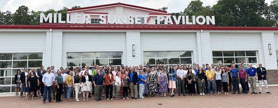 Kosciusko Chamber of Commerce members gather for a group photo at the Miller Sunset Pavilion in Winona Lake Thursday. Photo by David Slone, Times-Union.