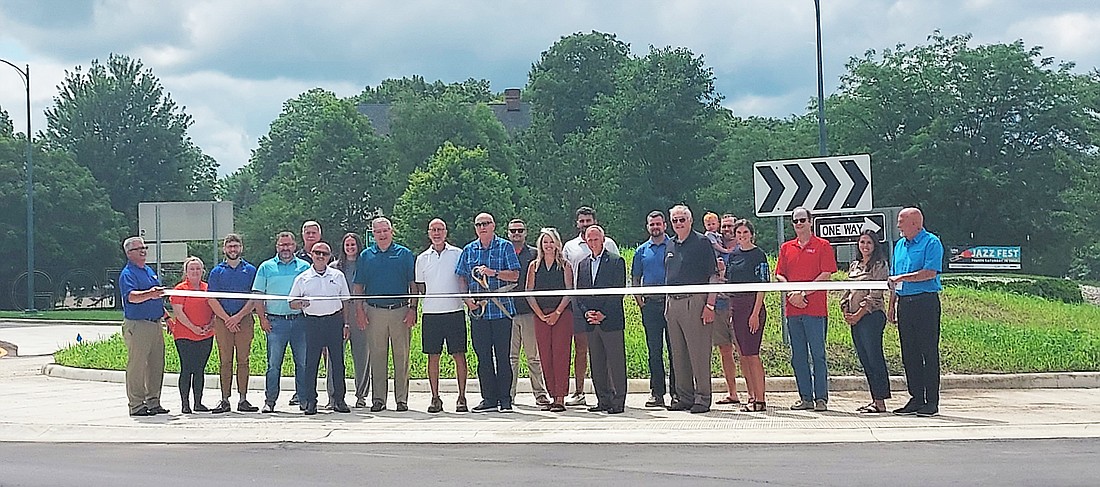 A ribbon-cutting was held Friday celebrating the completion of the roundabout at the intersection of Park Avenue, Kings Highway, Winona Avenue and Argonne Road. Pictured are members of the Winona Lake Town Council, Warsaw Mayor Joe Thallemer, Kosciusko Chamber of Commerce staff and ambassadors and employees of Phend & Brown Inc. and A & Z Engineering LLC. Photo by Jackie Gorski, Times-Union