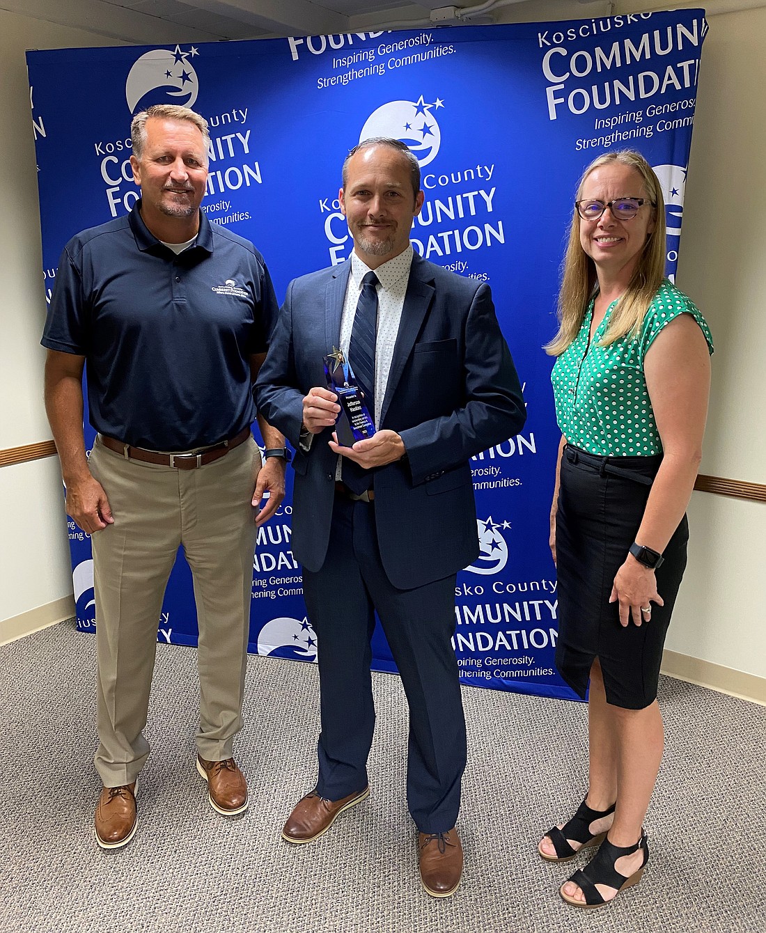 Kosciusko County Community Foundation presented Jefferson Hankins (C) with an award for excellent service as a member of KCCF’s finance and investment committee. Also pictured are KCCF finance and investment committee chair Steve Yeager (L) and KCCF CEO Stephanie Overbey (R). Photo Provided.