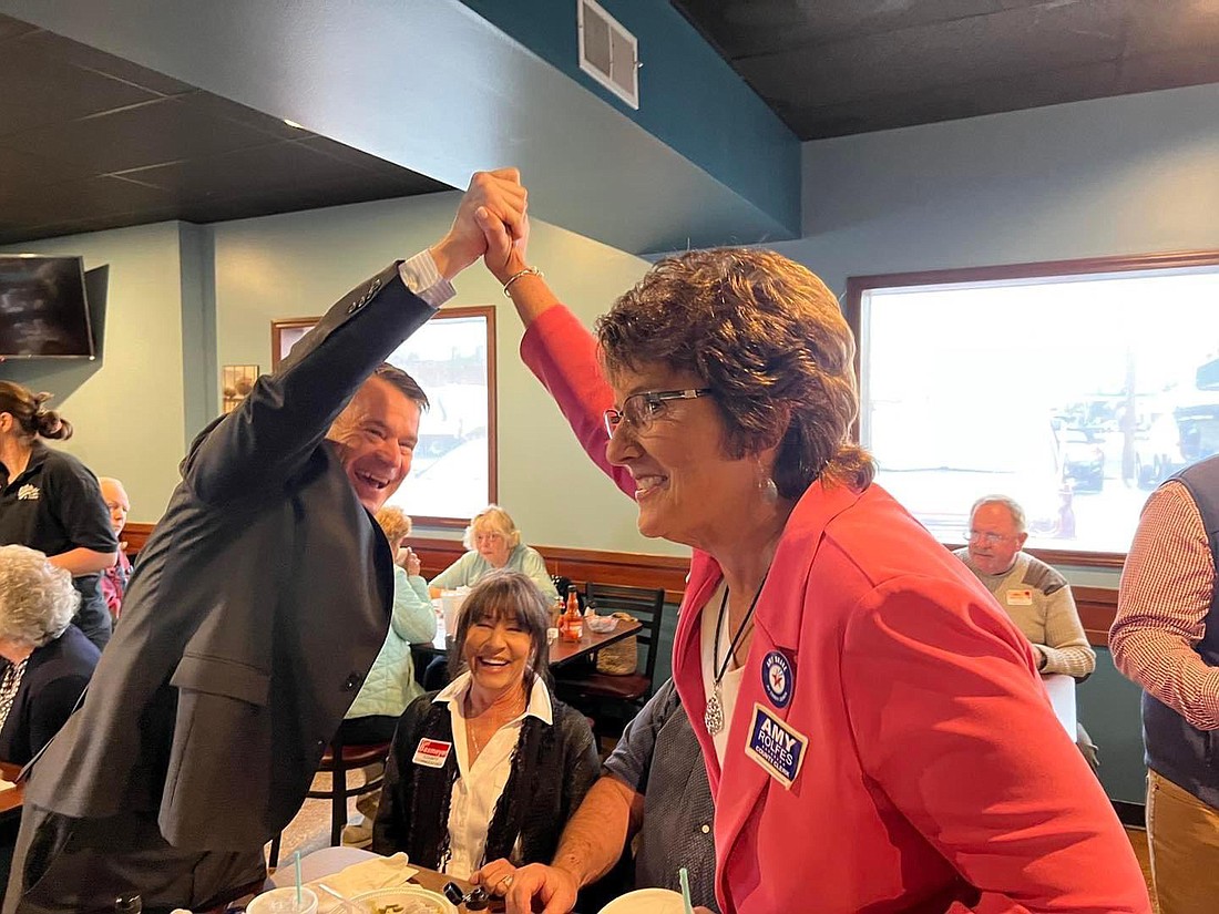 U.S. Senator Todd Young (L) and Congresswoman Jackie Walorski (R) grasp hands in celebration in this undated photo. Photo Provided by Senator Todd Young’s Office.