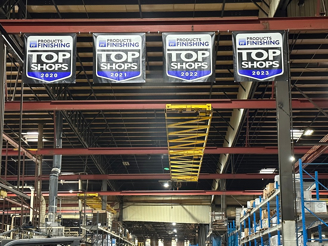 Banners showing Winona Powder Coating’s consecutive “Top Shop” awards are displayed in their factory in Etna Green.
Photo Provided