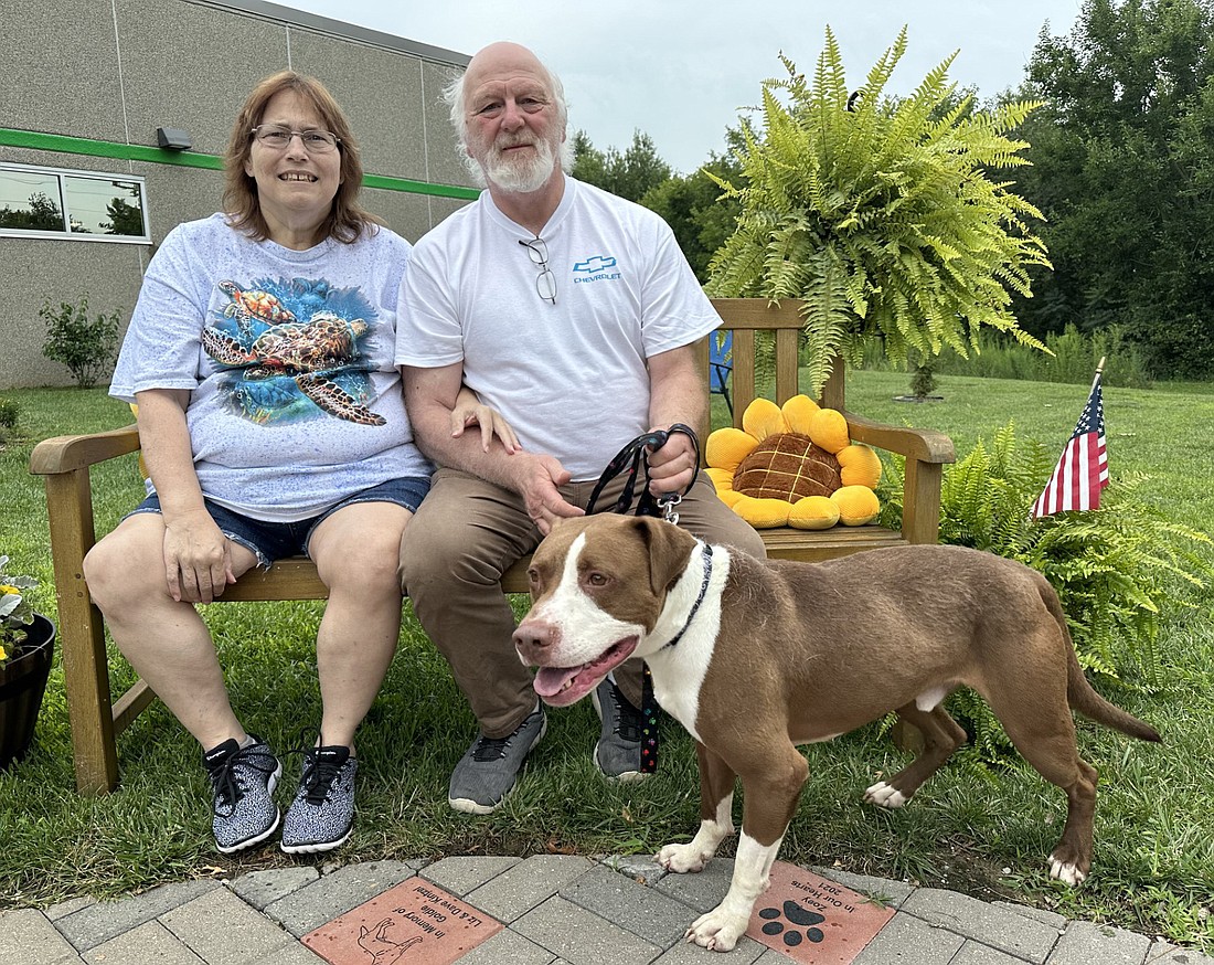 Barb and Art Karst took Rico home from the Animal Welfare League on Saturday. Rico was a resident of the shelter for 518 days before the Karsts decided to adopt him. Photo by David Slone, Times-Union.