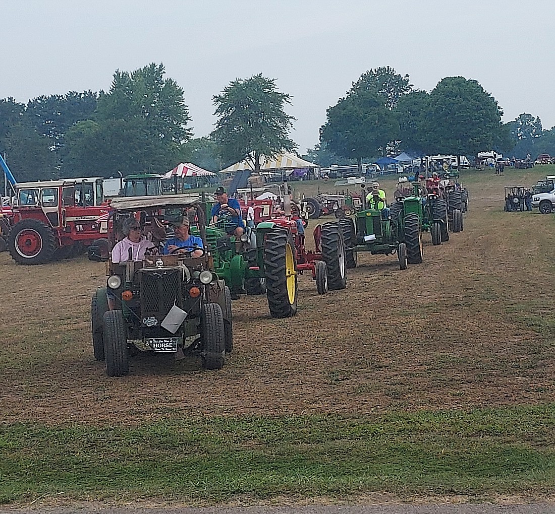 Tractors line up to turn onto CR 700S during the Kurt Miller Memorial Tractor Drive Saturday.Photo by Jackie Gorski, Times-Union