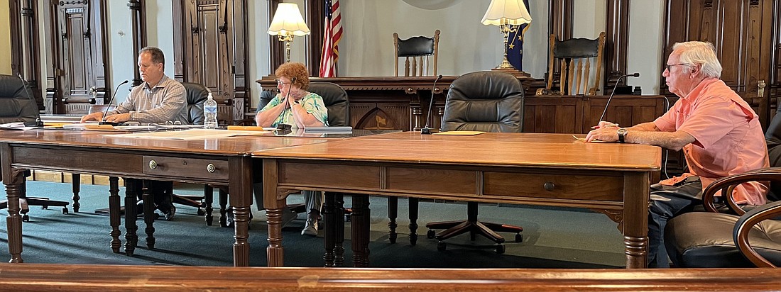 The Kosciusko County Redevelopment Commission discusses two consulting firm proposals presented at its meeting on Thursday. Pictured (L to R) are Commission Vice President Doug Hanes, President Joni Truex and member Mike Metzger. Photo by Brianna Pitts, InkFreeNews