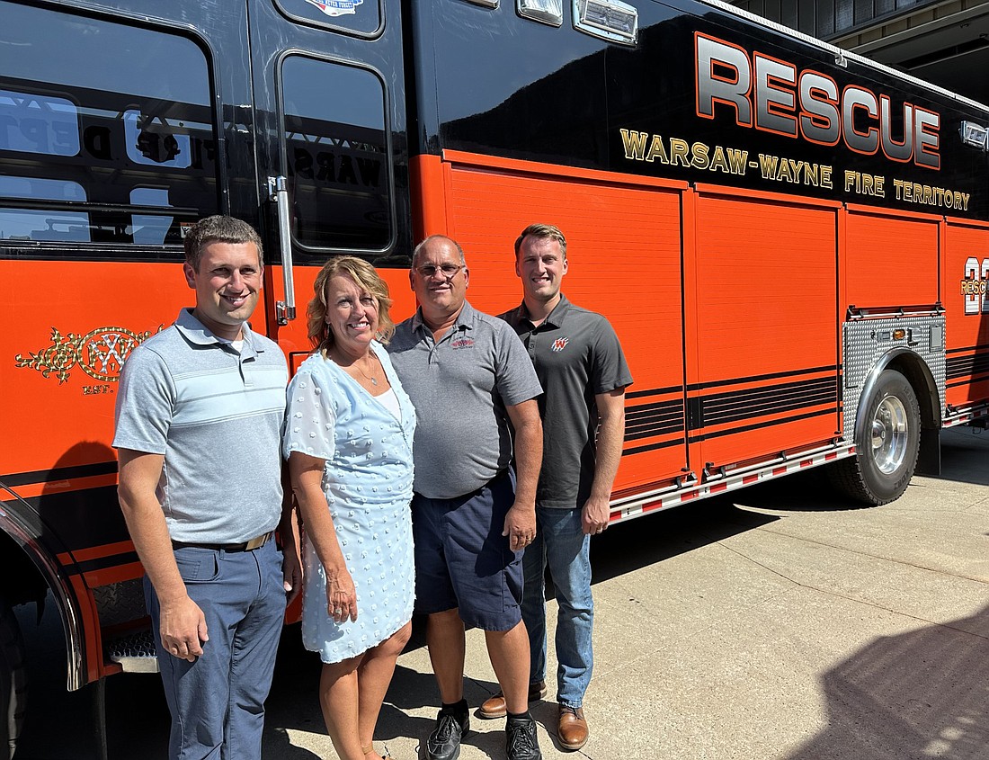 Brooks Huffer retired from the Warsaw-Wayne Fire Territory after a total of 34 years - nine as a volunteer and 25 full time. Pictured (L to R) are Tyler Huffer, son; Tena Huffer, wife; Brooks; and Cameron Huffer, son. Brooks’ third son, Derek Huffer, was unable to attend the retirement party Wednesday. Photo by David Slone, Times-Union