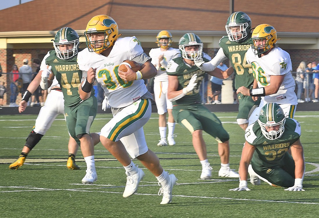 Sophomore Grady Moriarty of Tippecanoe Valley breaks through the Wawasee defense for a long gain during the first quarter. Photo by Gary Nieter