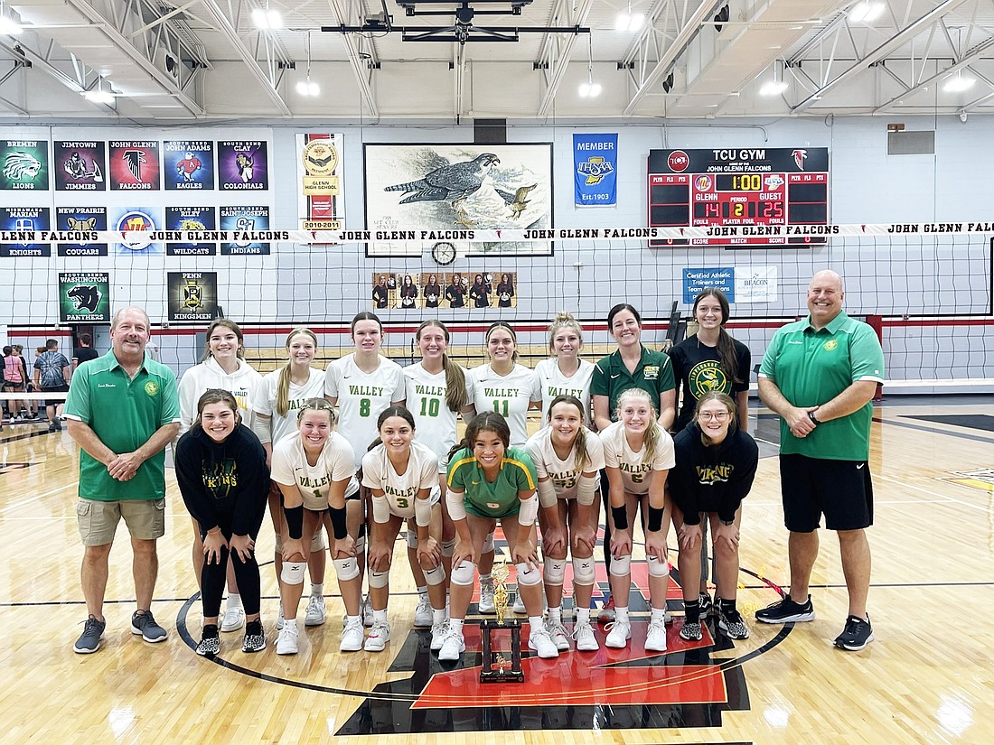 The Tippecanoe Valley volleyball team celebrates with a new piece of hardware after winning the John Glenn Tournament on Saturday.