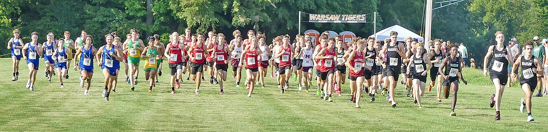 The boys set out from the starting line during Tuesday's Tiger Invitational Cross Country Meet at Warsaw. Photo by Gary Nieter