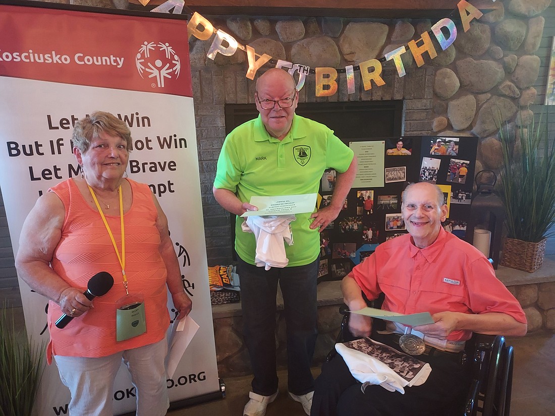 Special Olympics athletes Mark Warren and Tim Hunt were recognized Thursday for being part of the Special Olympics during the 50th birthday celebration at Tippy Creek Winery. Pictured (L to R) are Becky Walls, Kosciusko County coordinator; Warren and Hunt. Photo by Jackie Gorski, Times-Union