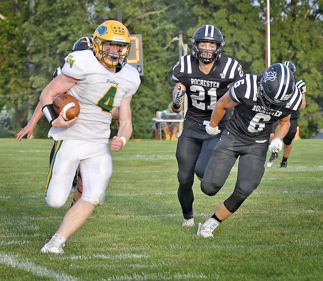 Tippecanoe Valley senior Nate Parker runs down the sideline past the Rochester defense to score Valley's second touchdown of the first quarter. Photo by Gary Nieter