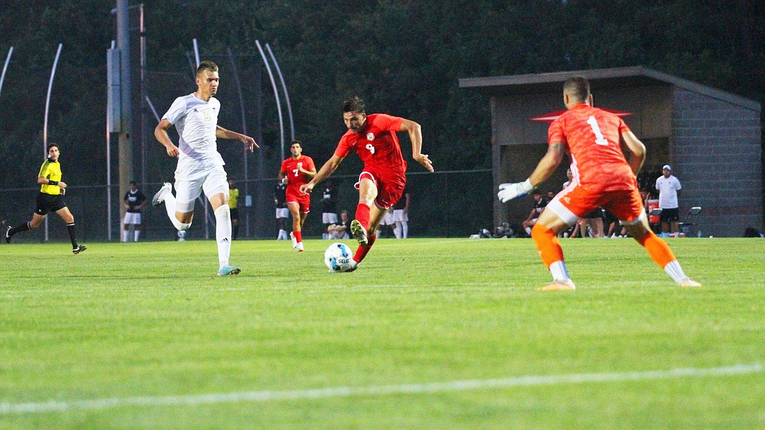 Grace’s Martim Sequeira lines up a shot on goal during the Lancers 4-0 victory over Governors State on Saturday. Sequeira netted three goals in the win.