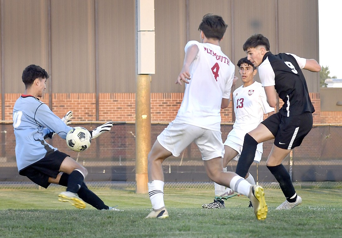 Senior Noah VanPuffelen scores Warsaw's second goal during Monday night's home match against Plymouth. Photo by Gary Nieter