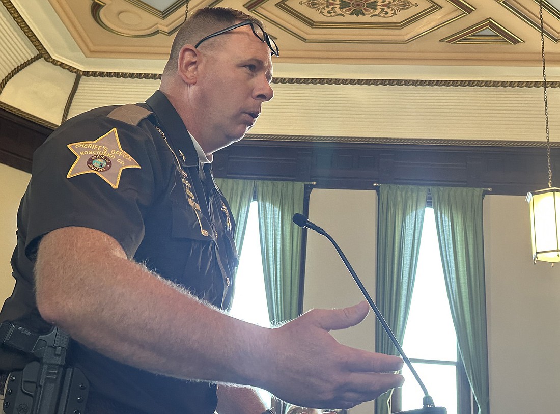 Kosciusko County Sheriff Jim Smith explains to the county commissioners Tuesday why an emergency purchase of a vehicle was made recently out of commissary funds. Photo by David Slone, Times-Union