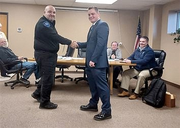 Town Marshal Jim Eads (L) is shown with deputy Jacob Bill after Bill was sworn into the Mentone Police Department April 6, 2022. Photo by Jackie Gorski, Times-Union