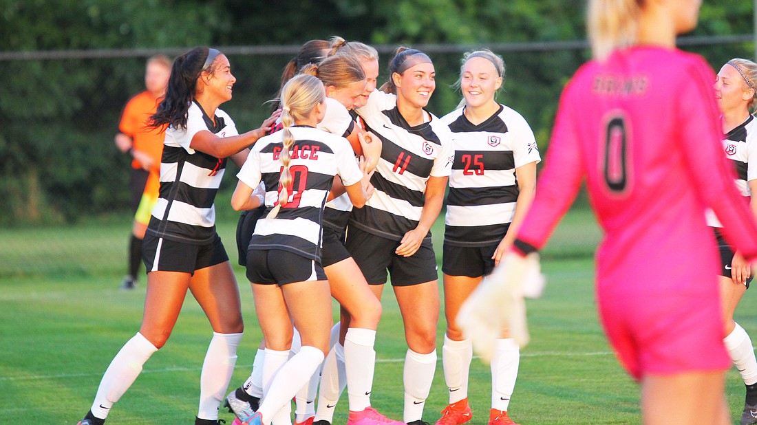 pictured is Grace's women's soccer team celebrating a goal during Saturday's 3-0 win over Carolina.