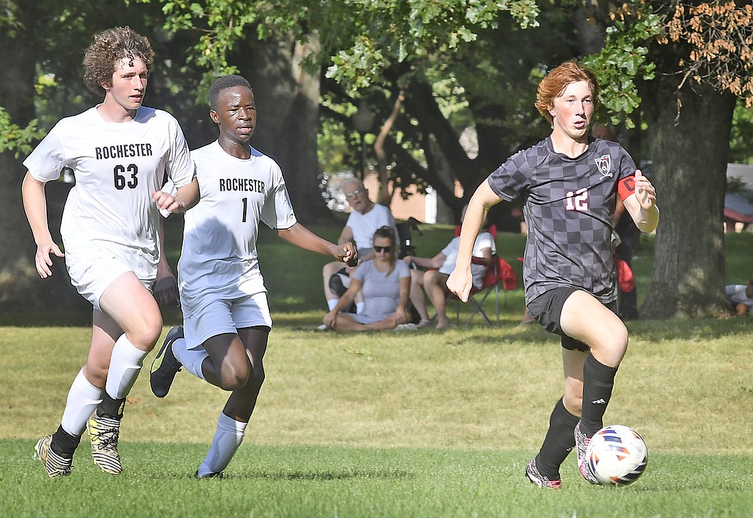 Senior Tyler McClain races past Rochester defenders en route to scoring Manchester's first goal. Photo by Gary Nieter