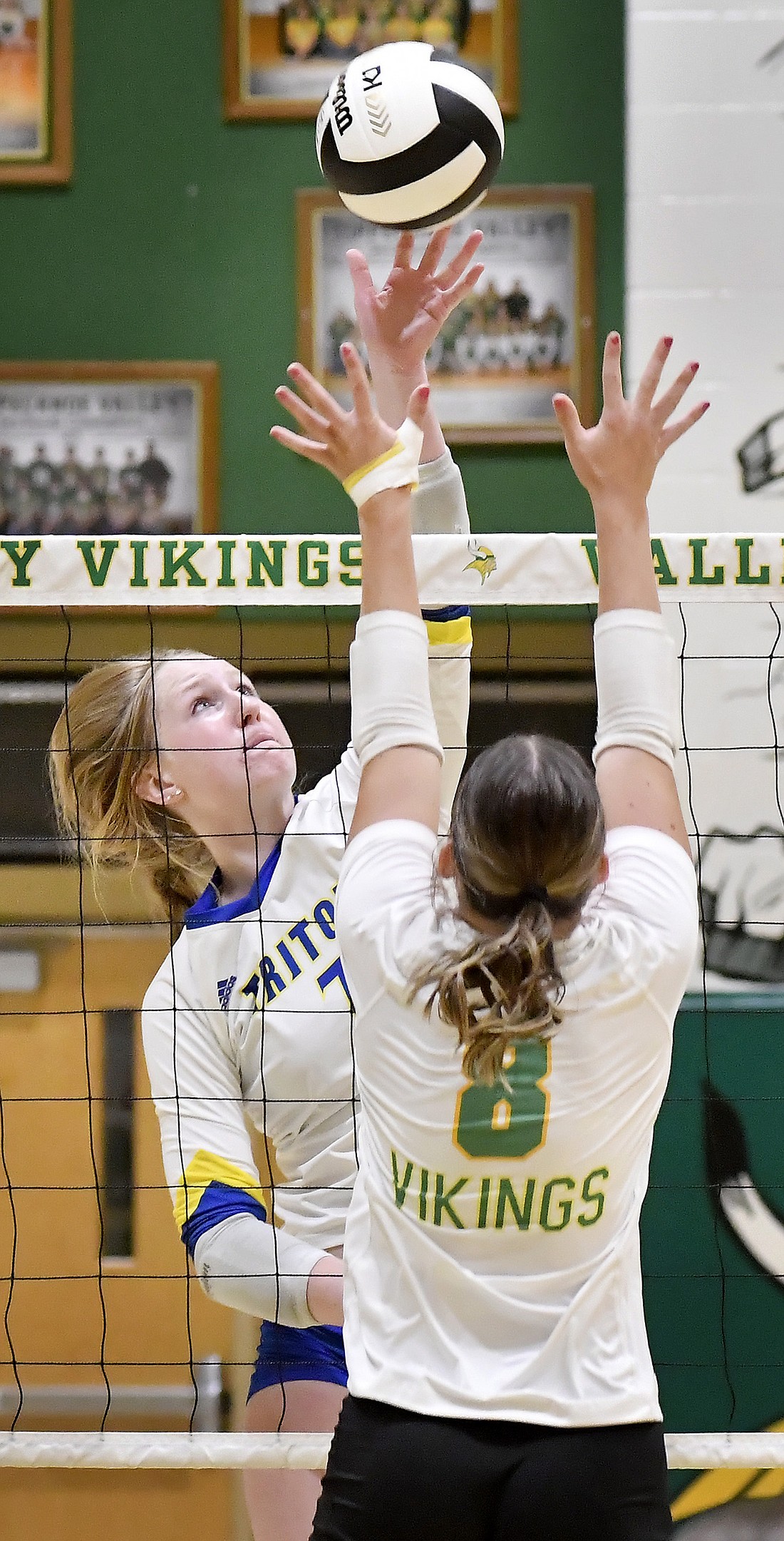 Junior Mya Davis of Triton goes up for a kill as Valley's Ava Egolf defends during the second set of Thursday night's match at Tippecanoe Valley. Photo by Gary Nieter