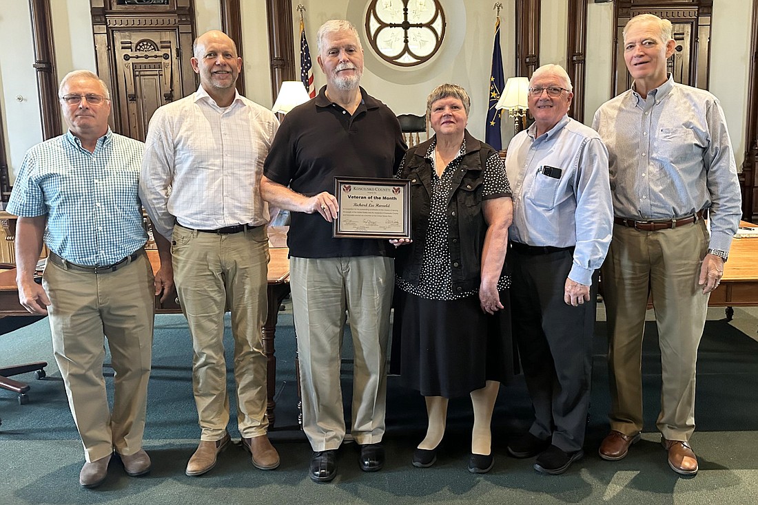 Richard Harrold is the September 2023 Kosciusko County Veteran of the Month. Pictured (L to R) are Kosciusko County Veteran Service Officer Darryl McDowell, Commissioner Cary Groninger, Richard Harrold, Richard’s wife Patsi Anne Harrold and Commissioners Bob Conley and Brad Jackson. Photo by David Slone, Times-Union