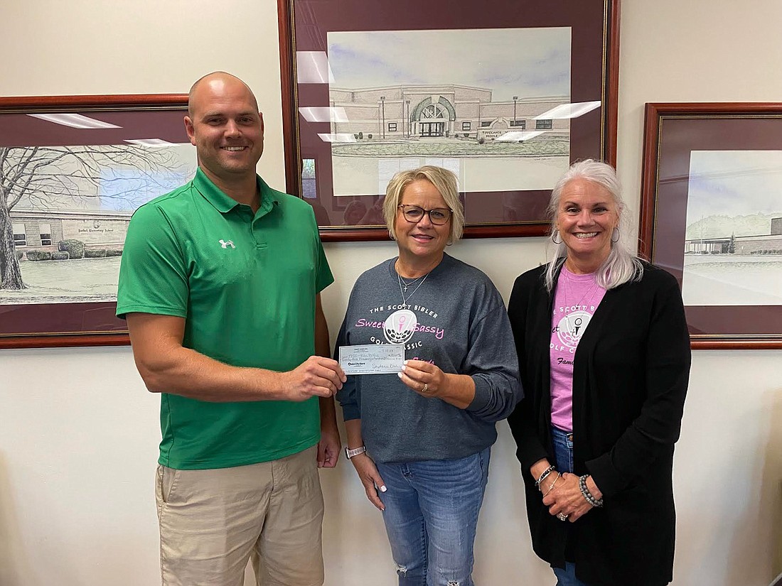 At the Tippecanoe Valley School Board meeting Monday, Tippecanoe Valley School Corporation received a $23,500 donation raised from the Scott "Bibs" Bibler Sweet Sassy Golf Classic. Pictured (L to R) are TVSC Board President David Lash, Bibler's widow Steph Bibler and golf classic committee member Sara Boganwright. Photo by Leah Sander, InkFreeNews