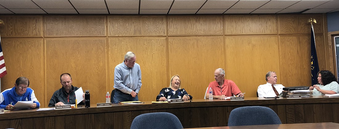 Syracuse Town Council members prepare and chat before Tuesday night’s lengthy meeting. Pictured (L to R) are council members Bill Musser, Nathan Scherer, Larry Siegel, Cindy Kaiser and Paul Stoelting; town attorney Jay Rigdon and Clerk-Treasurer Virginia Cazier. Photo by Denise Fedorow