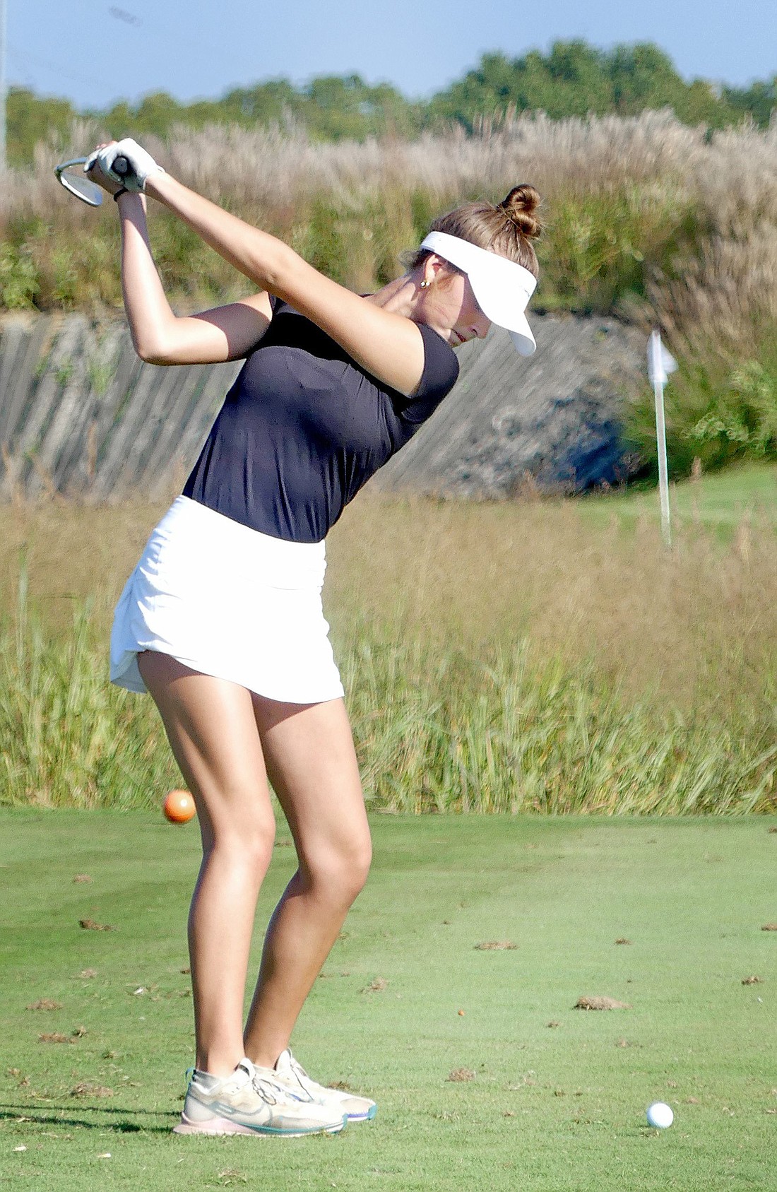 Warsaw senior Olivia Robinson-Gay tees off on the second hole during Friday morning's Regional. Photo by Gary Nieter