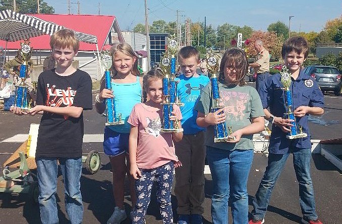 Syracuse Cub Scout Pack #3828 captured trophies at the Lincolnway District Annual Cubmobile Races in Warsaw. Pictured are Trent Ritter, Eva Aites, Kenlyn Sims, Evan Scott, Hazel Ratty and Zander Monroe. Not pictured is Noah Wells. Photo Provided.