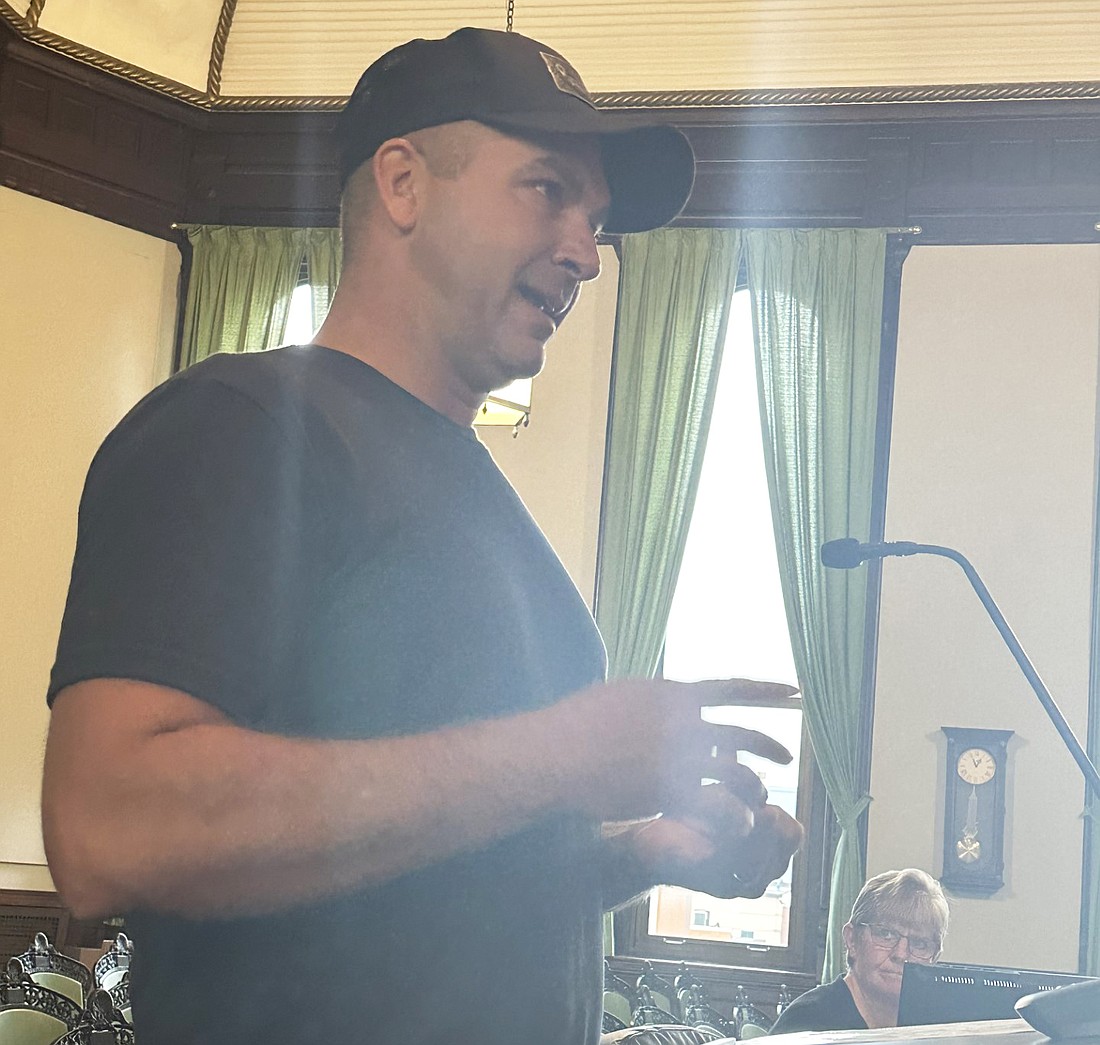 Nate Myers asks the Kosciusko County Commissioners Tuesday about when the property at 9020 S. Smalley Lane, Claypool, will be sold at a sheriff’s sale.  Photo by David Slone, Times-Union