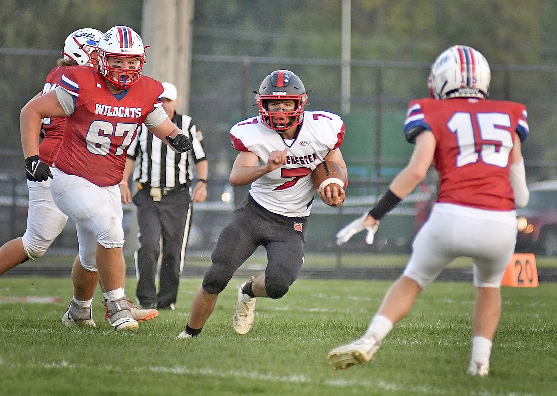 Manchester junior quarterback Logan Eastgate picks his way through the Whitko defense during the first quarter. Photo by Gary Nieter