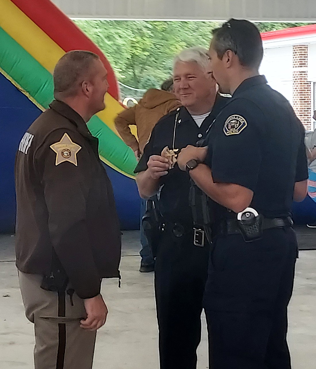 (L to R) Kosciusko County Sheriff’s Office Public Information Officer Sgt. Doug Light, Winona Lake Town Marshal Joe Hawn and Phillip Hawks, school resource officer at Lakeland Christian Academy, talk at the Faith & Blue event Saturday at the Miller Sunset Pavilion. Photo by Jackie Gorski, Times-Union