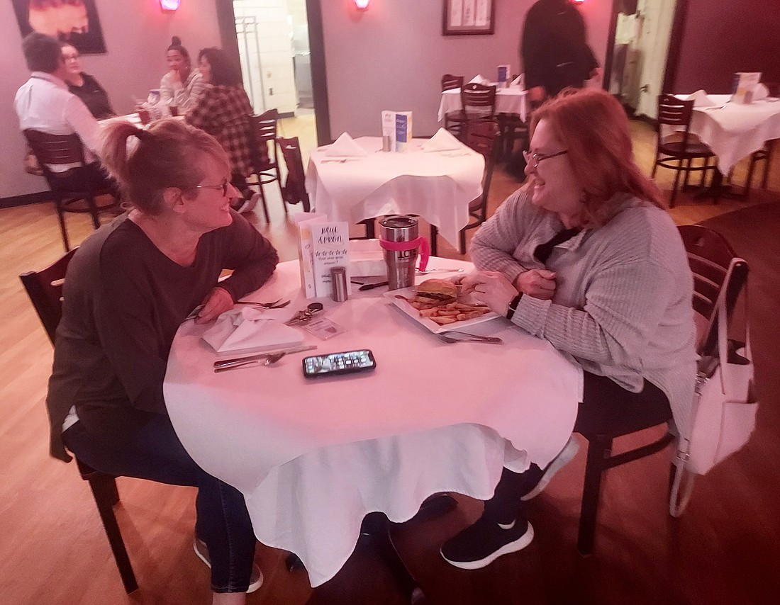 Lori Owens (L) and Tia Brown (R) enjoy lunch on the last day of the soft opening Wednesday of the Blue Apron at the Warsaw Area Career Center this school year. Photo by Jackie Gorski, Times-Union