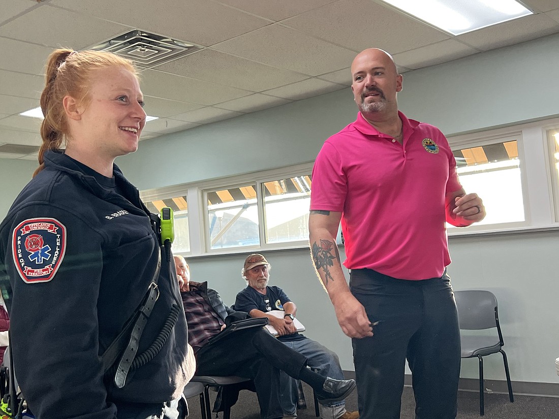 Paramedic Brooklyn Bradley (L) is introduced to the North Webster Town Council by Tippecanoe Township Trustee Chris Francis (R) during Tuesday night’s regular council meeting. Photo by Keith Knepp, InkFreeNews