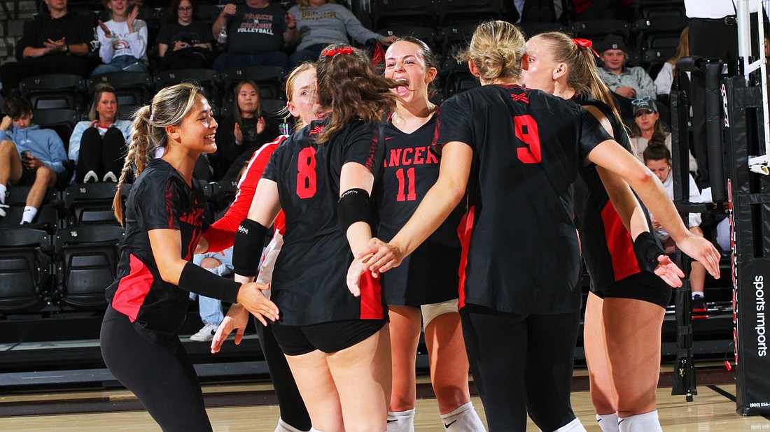 Pictured is Grace's volleyball team in the midst of its 3-1 win over Spring Arbor on Saturday