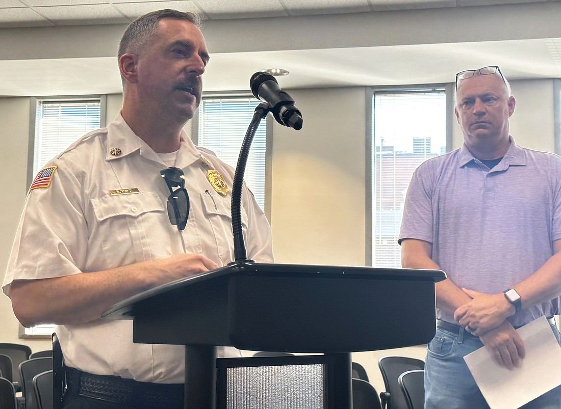 Warsaw Fire Department Chief Brian Mayo (L) explains the part-time firefighter program to the Warsaw Board of Public Works and Safety Tuesday, with Warsaw Human Resource Director Denny Harlan (R) standing by. Photo by David Slone, Times-Union
