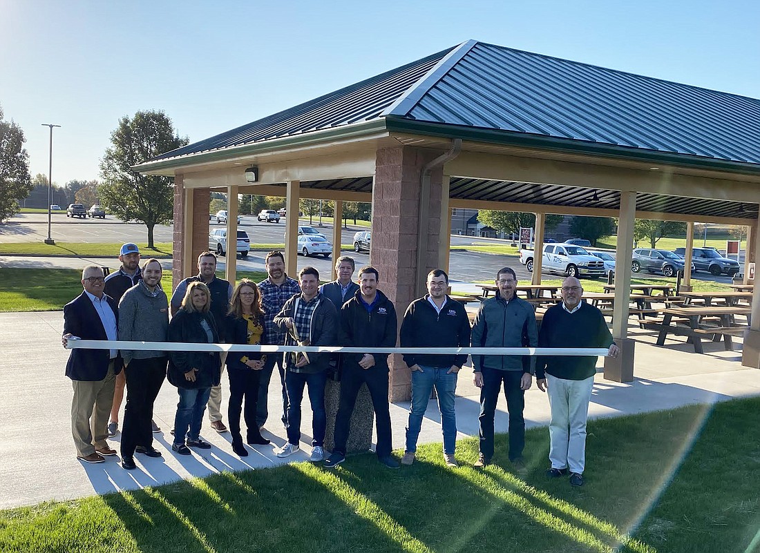 The Kosciusko Chamber of Commerce celebrated Warsaw Community Church’s new pavilion with a ribbon-cutting on Tuesday. KPS Commercial Construction built it, and it was designed by AccuCAD Drafting Service. Pictured (L to R) are, front row: Chamber President and CEO Rob Parker; Chamber ambassadors Matthew Bochard, Dawn Jaggers and Tammy Smith; WCC Executive Pastor Matt Moyer; KPS’ Dane Kennedy and Andrew Baker; AccuCAD’s Gary Hochstedler; and Chamber Member Relations Manager Scott Wiley; back row: Chamber ambassadors Joe Bowles and Griffyn Carpenter; WCC Facilities Director Robert Cunningham and WCC Elder Dennis Cultice. Photo by Leah Sander, InkFreeNews