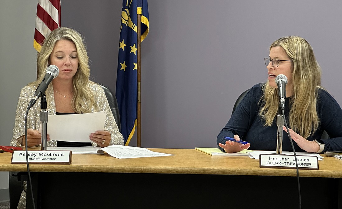 At her first meeting as Winona Lake’s new clerk-treasurer, Heather James (R) explains the claims to the Winona Lake Town Council Thursday, which Councilwoman Ashley McGinnis (L) is reviewing. Photo by David Slone, Times-Union