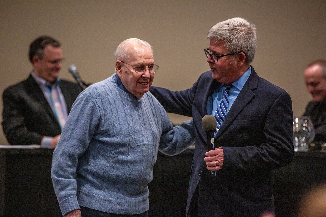 Pictured are Charlie Garner (L), a 100-year-old Normandy veteran, and David Neff, executive director of Kosciusko Senior Services. Photo Provided.