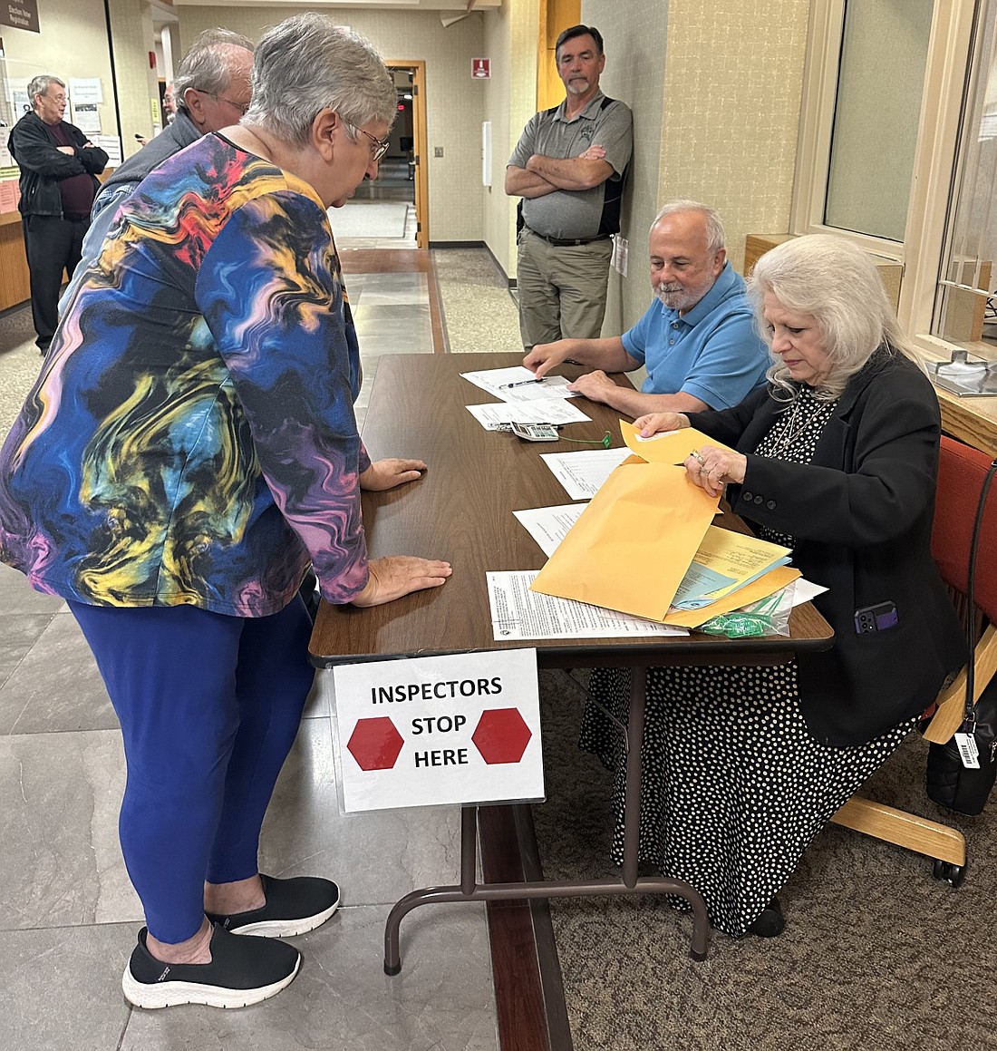 Election inspector Patty Yarian (L) speaks to poll workers Jack Brunetto (back) and DeAnna Ragan (R) after turning in some of the election results at the Kosciusko County Justice Building Tuesday night. Photo by David Slone, Times-Union