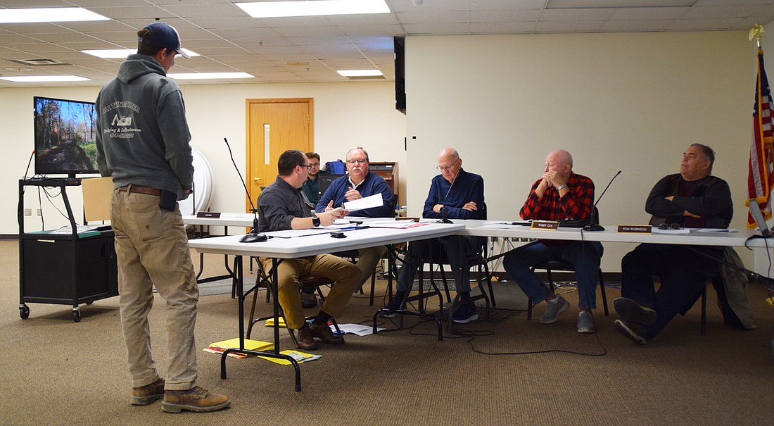 Joel Katzer (L) makes his plea to the Kosciusko County Board of Zoning Appeals. Also pictured are Area Plan Director Matt Sandy and BZA members Kevin McSherry, Lee Harman, Randy Cox and Ron Robinson. Photo by David Slone, Times-Union