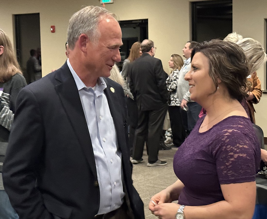 Rachael Rhoades (R) talks to Indiana Rep. Craig Snow (L) after officially kicking off her campaign to seek an at-large seat on the Kosciusko County Council. Photo by David Slone, Times-Union