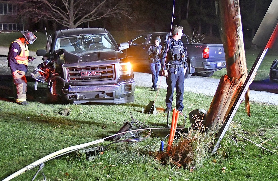 Officials investigate the scene of Monday night's single-vehicle accident on CR 175E, north of CR 75N. Photo by Gary Nieter, Times-Union