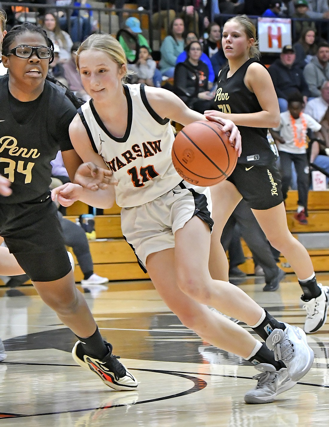 Warsaw sophomore Joslyn Bricker drives to the basket during the second quarter of Tuesday night's home game against Penn. Photo by Gary Nieter