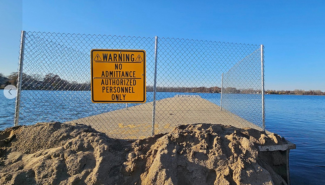 The old Center Lake pier has been closed off because of damage and will be removed, perhaps next year. The city is seeking money to remove the pier. Photo by Dan Spalding, News Now Warsaw.