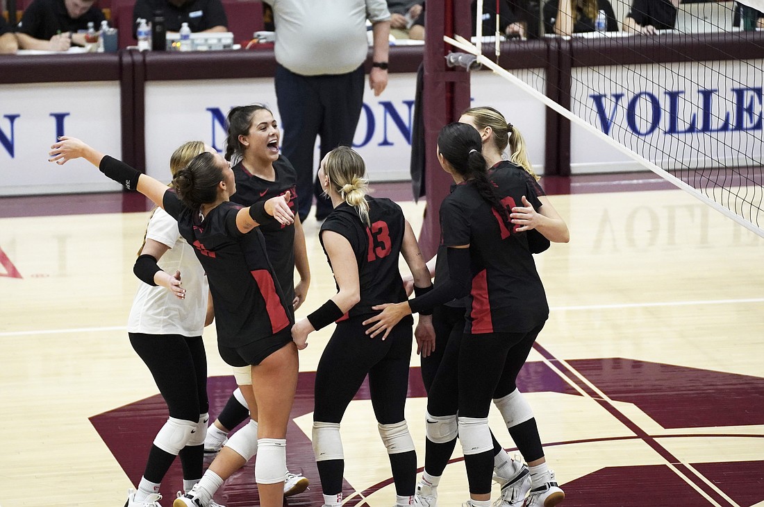 Pictured is Grace's volleyball team celebrating its win over Baptist Bible on Wednesday. Photo by Grant Cook